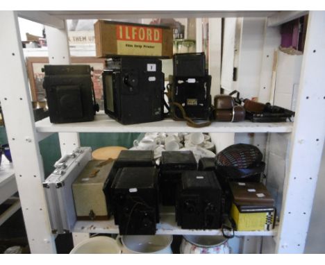 Nine early box cameras and other camera equipment