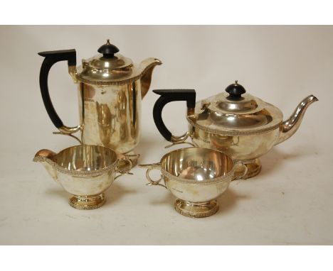 A mid 20th century silver four piece tea and coffee service of plain undecorated form by Walker & Hall of Sheffield