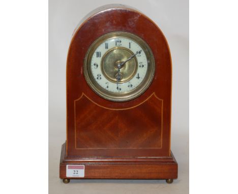 An Edwardian mahogany and satinwood strung mantel clock, having an enamel dial with Arabic numerals, and cylinder movement 