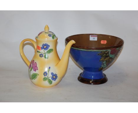 An early 20th century Royal Doulton pedestal bowl, on a blue ground with fruit and vine decoration, impressed lion and crown 