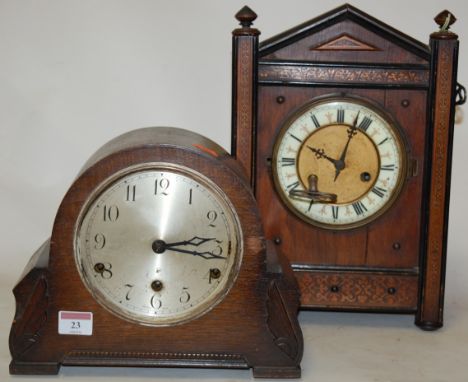 A late 19th century continental oak and pine cased mantel clock, having an enamel dial with Roman numerals, and eight day mov