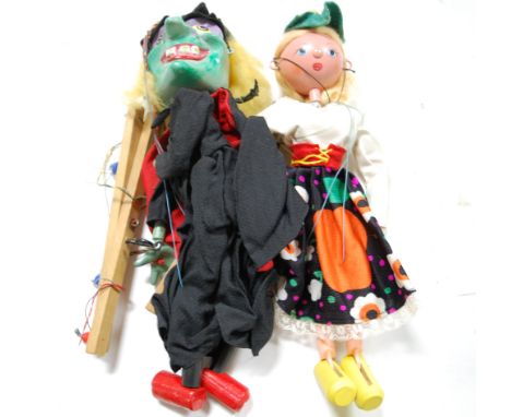 A Pelham Puppet of a witch, together with one other of a girl (2)