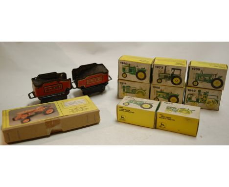 A scaled down model of an Alice Chalmers tractor, Model B 1939, together with various Ertl John Deere model tractors, and two