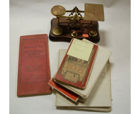 A set of brass postal scales and weights together with various Ordnance Survey maps