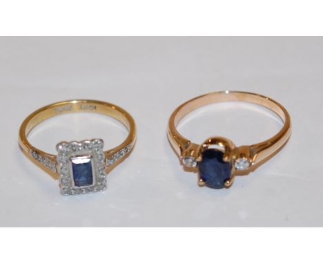 A yellow metal sapphire and diamond ring arranged as an oval cut four claw set sapphire flanked to either side by small brill