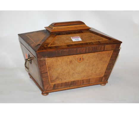 A circa 1830 burr walnut and rosewood crossbanded tea caddy, of sarcophagus form, having fitted interior, flanked by brass ri