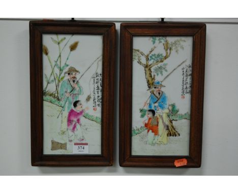 A pair of Chinese porcelain panels, each painted with a fishermen in a wooden surround Condition Report / Extra Information 2