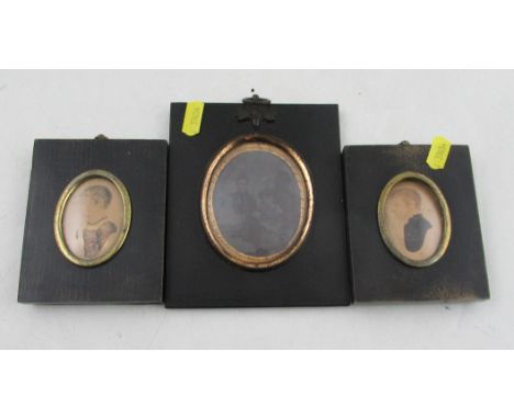 Two framed portrait miniatures, watercolour on paper, maximum diameter 2ins, together with a framed daguerreotype