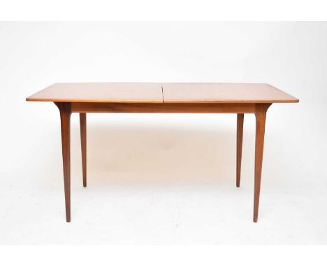 A mid-20th century McIntosh teak extending dining table, with concealed folding centre leaf, the tonneau-shape top raised on 