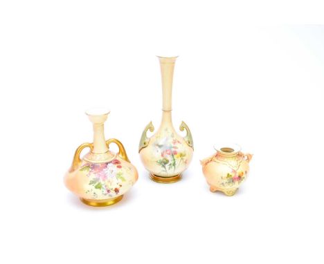 A group of three pieces of Royal Worcester blush ivorycomprising a vase, the bulbous body with twin handles and tall tapering