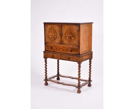 A reproduction William and Mary style marquetry walnut and mahogany cabinet on standOf Dutch influence, the moulded top above