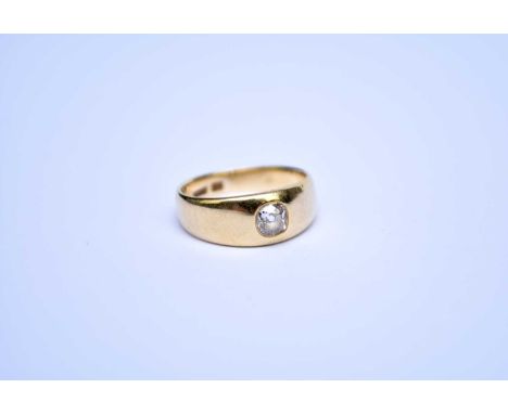 A single stone diamond set ring, the old cut diamond mounted within tapering yellow metal shank, stamped '18', ring size K, w