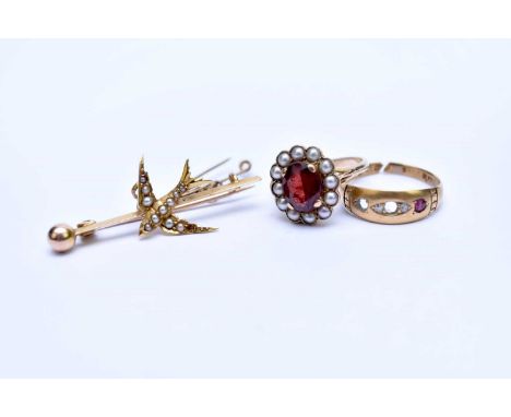 A garnet and split pearl oval cluster ring, stamped '9ct', ring size K, together with a seed pearl set swallow bar brooch and