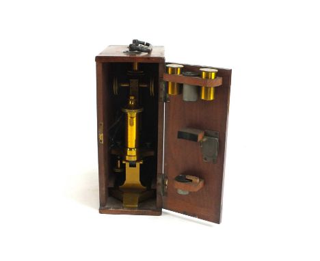 A cased R &amp; J Beck brass monocular microscope, circa 1900, serial number 24386, with x8, x10, and x15 eyepieces and 16mm 
