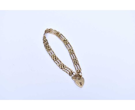 A 9ct gold gate link bracelet, with heart shaped padlock clasp, weight approx 10.1g