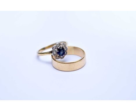 A sapphire and diamond floral cluster ring, stamped 'Plat 18ct', ring size K 1/2, together with an 18ct gold wedding band, si