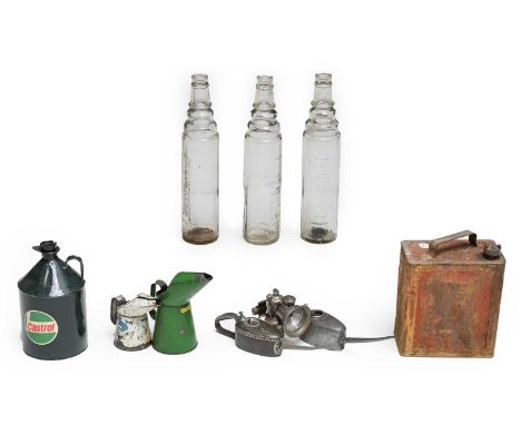 Three Esso Lube Clear Glass Oil Bottles, 38cm high; Two Metal Oil Jugs; A Painted Castrol Oil Canister, with transfer printed