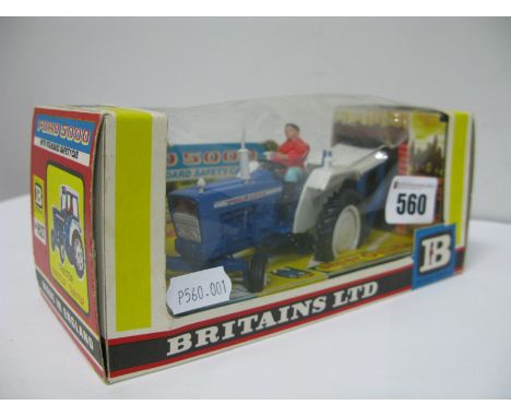 A 1973 Britains No. 9527 Ford 5000 Tractor, with safety cab, very good, boxed, tears to cellophane.