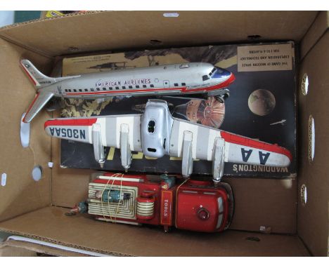 A Tinplate Japanese Fire Engine, a tinplate Japanese 'American Airlines' Aircraft and a 'Game of Blast Off', all playworn.