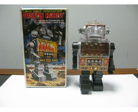 A Circa 1970 Japanese Manufactured Battery Operated Plastic Toy Piston Robot, featuring 'See Thru 8 Pistons', boxed.