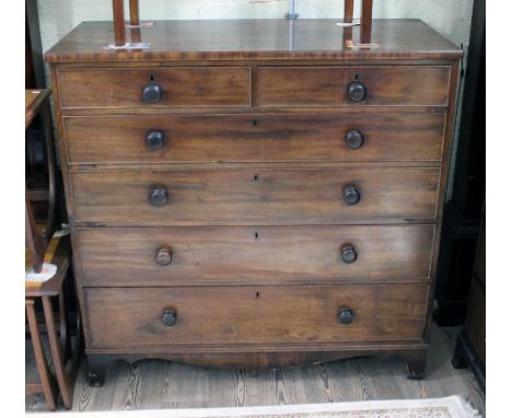 A 19th Century mahogany chest of drwaers with bun handles and bracket feet, width 119cm, depth 54cm & height 117cm.