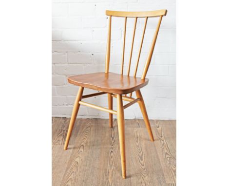 An Ercol light elm and beech spindle back chair.
