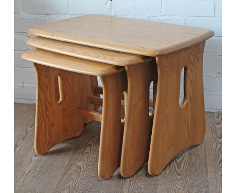 An Ercol Windsor light elm and beech nest of tables, largest table: length 63.6cm, depth 41cm & height 44.5cm.Condition:  No 