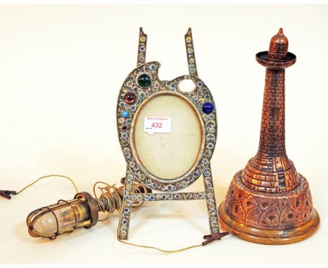 A mixed lot of metal ware comprising a ship's hanging light, a copper lighthouse and a decorated brass model easel.