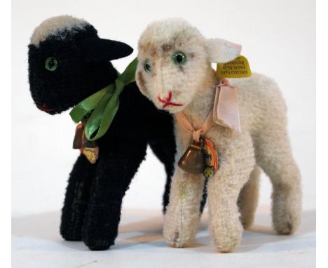 Two Steiff Lamby soft toys.