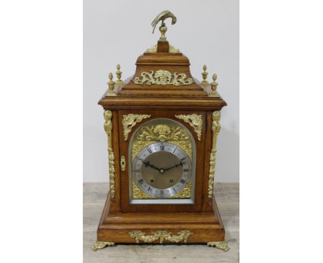 A large gilt metal mounted oak mantel clock, the brass and steel dial inscribed 'W Roberts Coventry', height 70cm.Condition: 