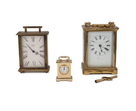 A 20th century brass cased carriage clock,&nbsp; the enamelled dial with Roman numerals (with key),&nbsp; together with a sma