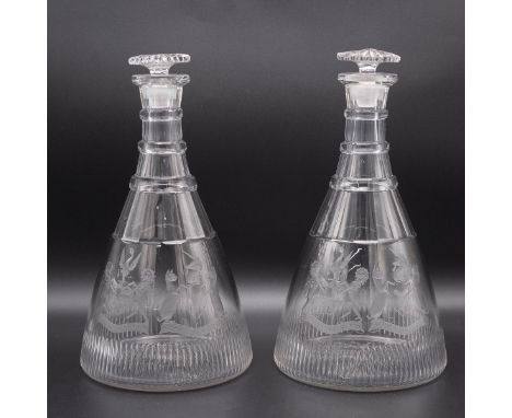 A near pair of late Georgian style magnum cut glass ship's decanters each with three neck rings, mushroom stoppers and etched