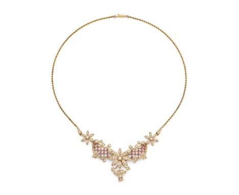 An early 20th century ruby and seed pearl necklace  The central motif of pierced stylised floral design, set throughout with