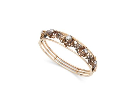  A diamond bangle  Of hinged design, the front half with foliate detail set with rose-cut diamonds, unmarked Internal width: 