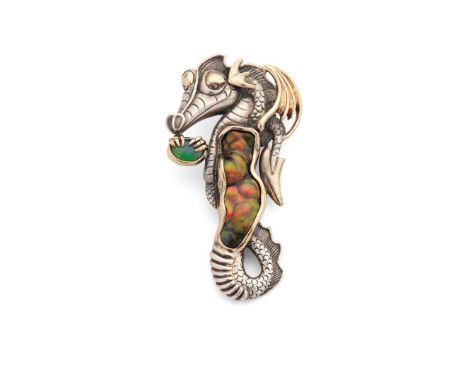  A silver gem-set dragon pendant  Modelled as a stylised dragon with gilt detail, collet-set with a fire agate and a small bl