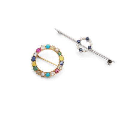  Two early 20th century circular brooches  The first circular openwork brooch set with various gemstones including ruby, sapp