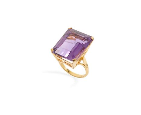  A 9ct gold large amethyst cocktail ring  Claw-set with a large rectangular step-cut amethyst, plain band, UK hallmarks Ring 