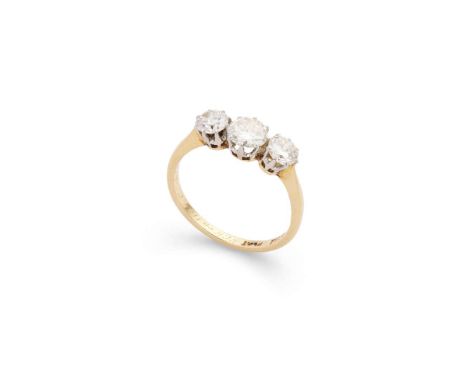 A diamond three-stone ring  Claw-set with three graduated round brilliant-cut diamonds, plain band, stamped 18CT PLAT Ring s