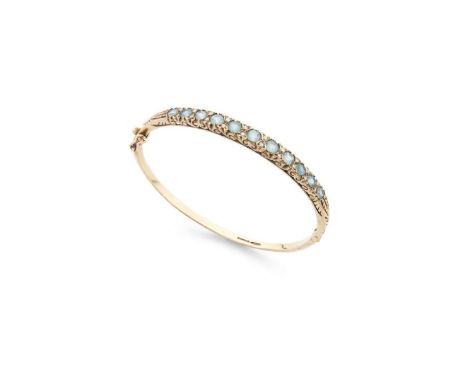  A 9ct gold aquamarine and diamond bangle  Of hinged design, the front half-set with graduated round-cut aquamarines and smal