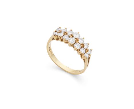  An 18ct gold diamond dress ring  Claw-set with two rows of graduated round brilliant-cut diamonds, plain band, UK hallmarks 