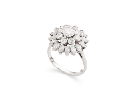  A diamond cluster ring  Claw-set with a round brilliant-cut diamond, weighing approximately 0.70cts, in a double border of r