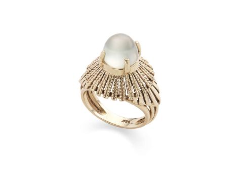  A retro moonstone ring, circa 1970s  The greenish cabochon moonstone raised above a radiating rope-twist surround, between p