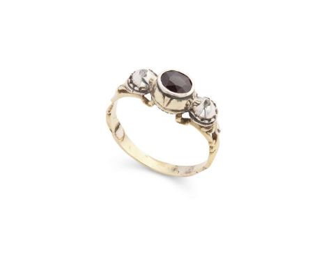  A late 18th century garnet and diamond three-stone ring, circa 1780s  Collet-set with an oval-cut garnet and two rose-cut di