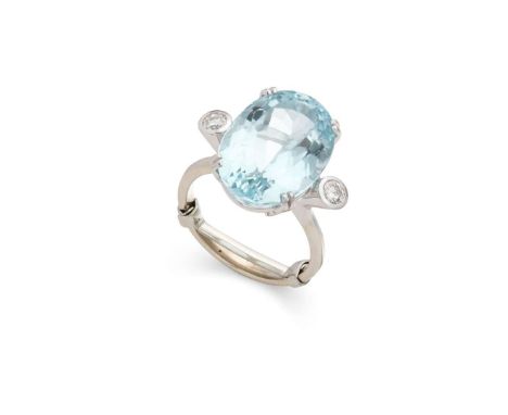  An aquamarine and diamond cocktail ring  Claw-set with an oval-cut aquamarine and two collet-set round brilliant-cut diamond