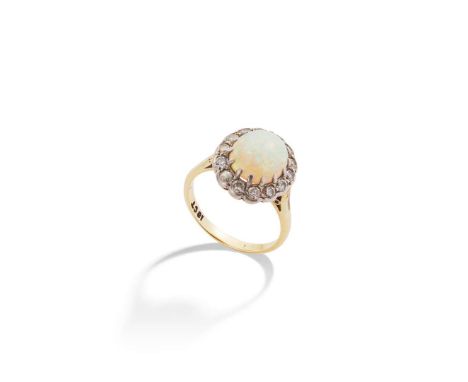  An opal and diamond cluster ring and matching earrings  Each claw-set with a cabochon opal in a border of brilliant-cut diam
