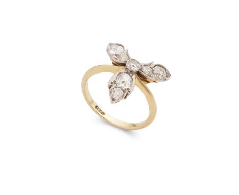  An early 20th century diamond dress ring  Of stylised floral design, set with graduated old round and cushion-cut diamonds, 