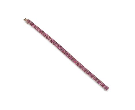 A ruby bracelet  Each graduated square link set with four round or cushion-cut rubies, unmarked Length: 18.0cm   