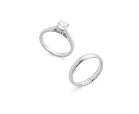  Rox: A platinum diamond single-stone ring  Claw-set with a round brilliant-cut diamond, weighing approximately 0.65cts, the 