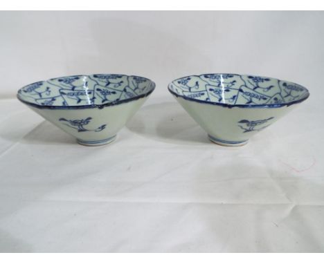 A pair of Chinese ceramic deep form bowls, blue and white decoration approx 6.5cm (h) 14.5cm diameter (2) - This lot MUST be 