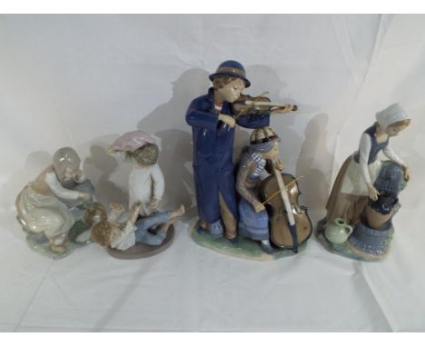 Nao - four figurines by Nao, largest approximately 34 cm (h) stamped and incised marks to the base (4). Estimate £50 - £80 - 